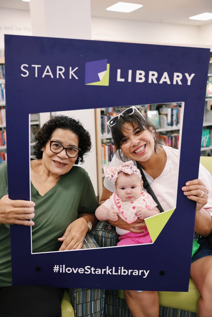 Mom, grandmother, and baby at Stark Library